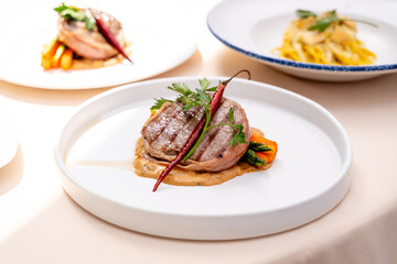 gourmet steak with grilled vegetables and sauce