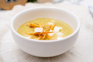 gourmet cream soup with cheese and crispy toppings