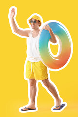 Happy young man with swimming ring on yellow background