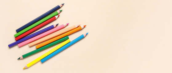 Fototapeta premium Colorful pencils on beige background