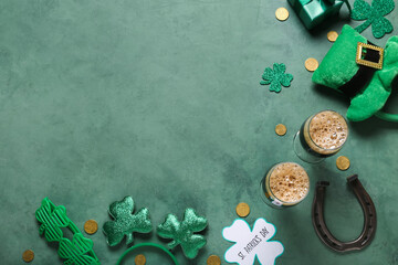 Glasses of dark beer with leprechaun hat, horseshoe and decor for St. Patrick's Day celebration on...