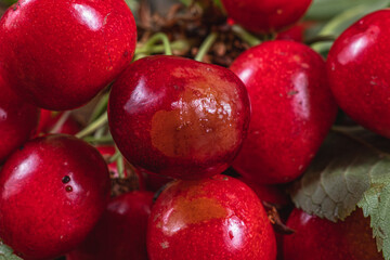 Wooden box with delicious ripe cherry macro