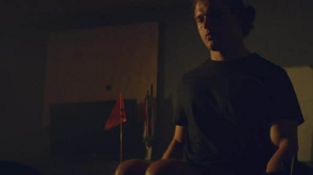 Para athlete in a garage
