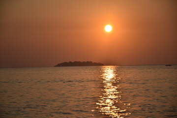 Beautiful sunset from a distance of small islands around the coast of Tanjung Gelam, Karimunjawa Islands, Central Java, Indonesia
