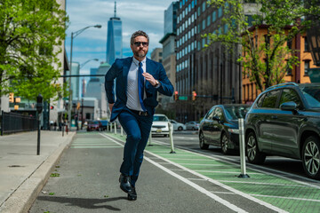 Business man in suit run in NY. American business. Businessman run down street, late for a meeting....
