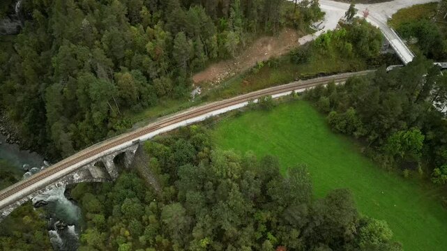 Scenic aerial reveal shot of Kylling railway bridge in Verma, Norway