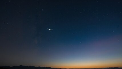 Fototapeta premium Sky at dawn with a crescent moon and stars, showcasing tranquility and natural beauty