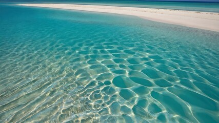 Naklejka premium Turquoise waters gently lapping against white sandy shore; perfect for tropical vacations