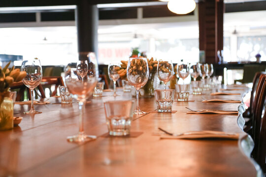 Table setting in restaurant ready for service with empty glasses