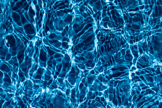 Close-up reflection of light on water surface