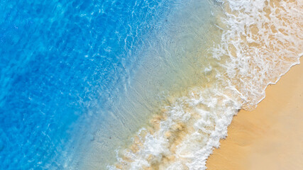 Top view beach sand background for summer vacation concept. Beach nature and summer seawater with sunlight light sandy beach Sparkling sea water 