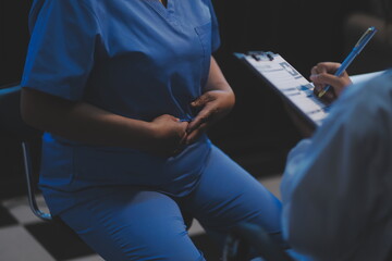 Charming female doctor giving advice to a female patient.