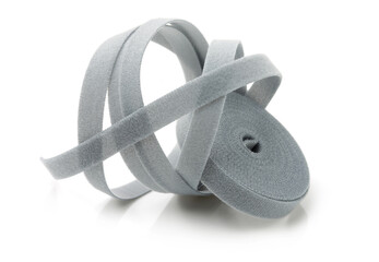 Gray roll of velcro tape on white background