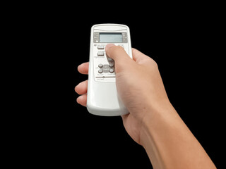Hand holding remote controls, televisions remote, air conditioning remote