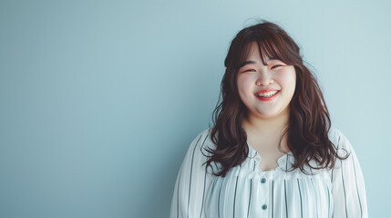 Fototapeta premium ぽっちゃりとした体型のアジア人女性