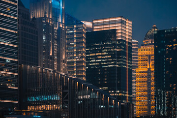 Obraz premium Urban skyscrapers in Shanghai at night; 