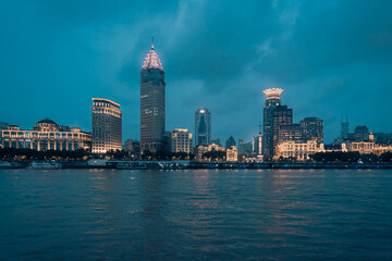 Obraz premium Urban skyscrapers in Shanghai at night; 