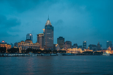 Obraz premium Urban skyscrapers in Shanghai at night; 