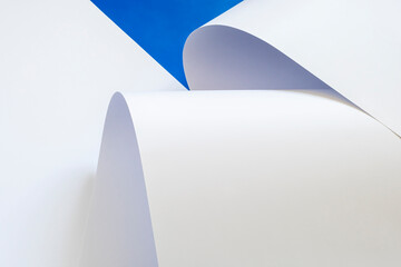 Sheets of white paper on a blue background.