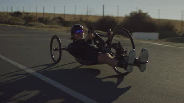 Para Athlete doing Cycling Training on the road on a sunny day