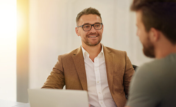 Businessman, computer and interview discussion with candidate for recruitment, opportunity and job research in office. Hr meeting, laptop and hiring conversation for vacancy, onboarding and online cv