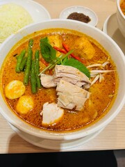 Malaysian dish named as curry mee or curry laksa. Noodles with curry sauce. 