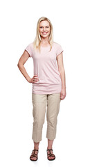 Fototapeta premium Happy, fashion and portrait of woman in studio with confidence, positive attitude and pride. Attractive, full length and face of isolated person with casual outfit on white background in Switzerland
