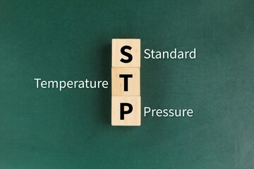 wood with the letters STP or the words Standard temperature and pressure
