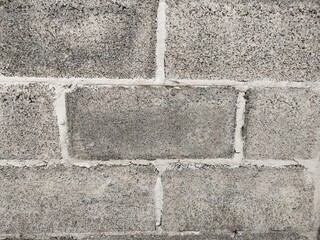 stone wall background  It pattern in rows, gray color from cement, It It builds a house.
