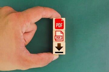 wooden square with PDF format file icon and download. the concept of saving a pdf file. concept of...