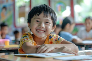 An asian happy kid is sitting at school lesson