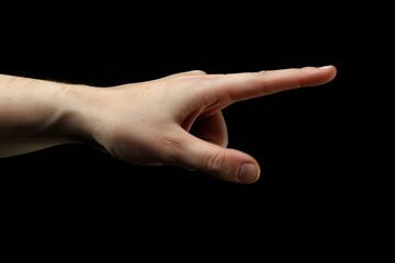 A hand pointing to the left Isolated on black background