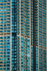 A close-up of a large apartment building with many windows
