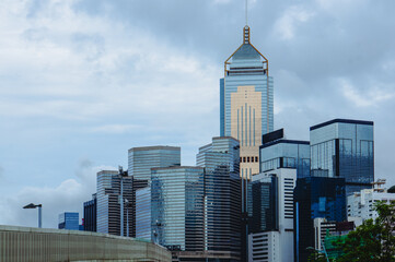 Fototapeta premium Tall buildings and cloudy sky in a city