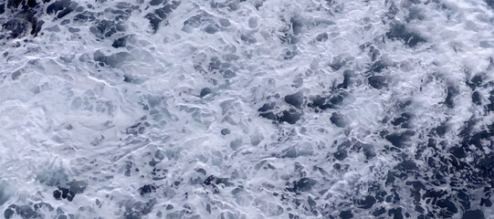Rough sea surface behind ship