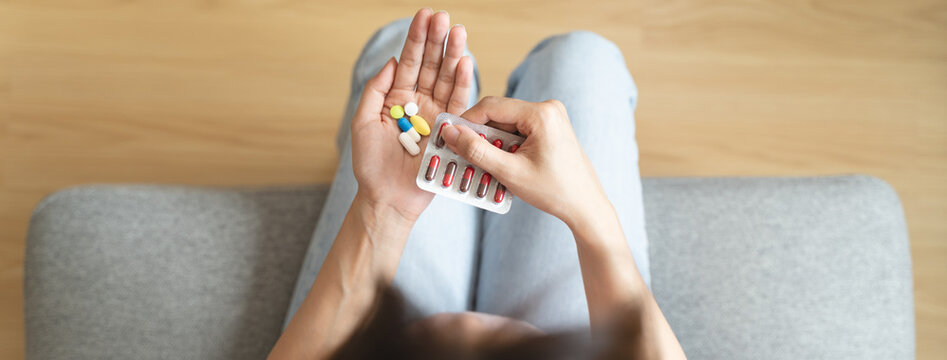 Healthcare Harmony: Close-Up Hands Holding Medication and Water Glass for Optimal Wellness, Pharmaceutical Treatment and mental health treatment