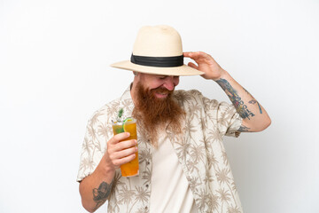 Redhead man with long beard drinking a cocktail on a beach isolated on white background laughing