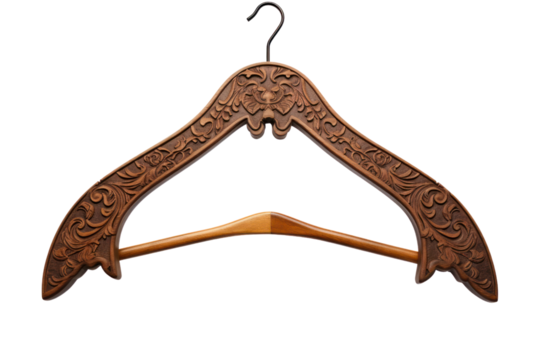 Vintage wooden clothes hanger with ornate carvings, isolated on white background
