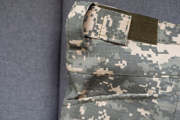 Ukraine Army uniform insignia badges on camouflaged uniform background.