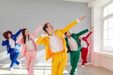 Colorful business people in bright suits dynamic and emotional dancing. Synchronized dancing movements paint lively picture joyous rhythm of dances infectious energy of dancing performance