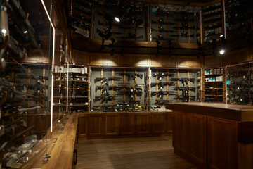 Modern weapon shop interior with guns, handguns, rifles, bullets arsenal