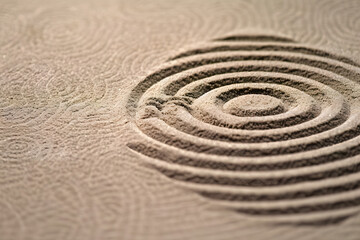 Naklejka premium A circle in the sand. Zen Japanese garden. Background.