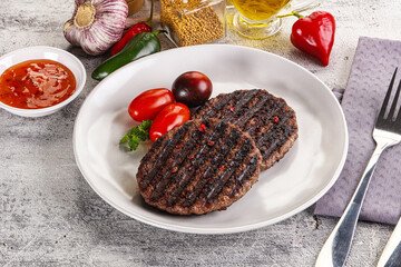 Grilled burger cutlet with sauce