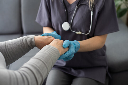 Health visitor and a senior woman during home visit