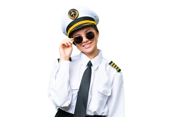 Airplane pilot woman over isolated chroma key background with glasses and happy