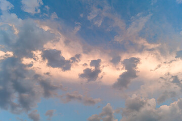 Clouds at sunset. Pink and yellow big clouds at sunset