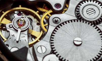 Clockwork old mechanical pocket watch. Macro shot.