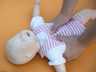 First aid training - mastering CPR techniques on a dummy