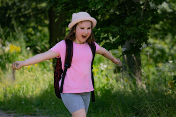 Little tourist girl is smiling and running . She looks happy. 