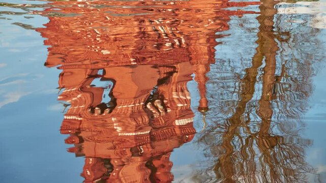 Reflection in water of Chernigovsky Skete belfry. Chernigovsky skete in Sergiev Posad, Russia is monastery standing unique for hand-dug monk cells and prayer caves.